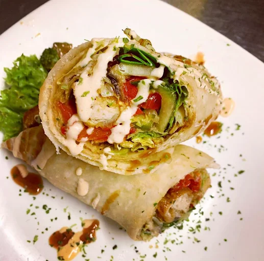 Caribbean roti wrap with tahini drizzle